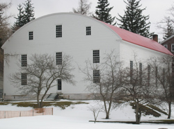 a large white building with a curved roof